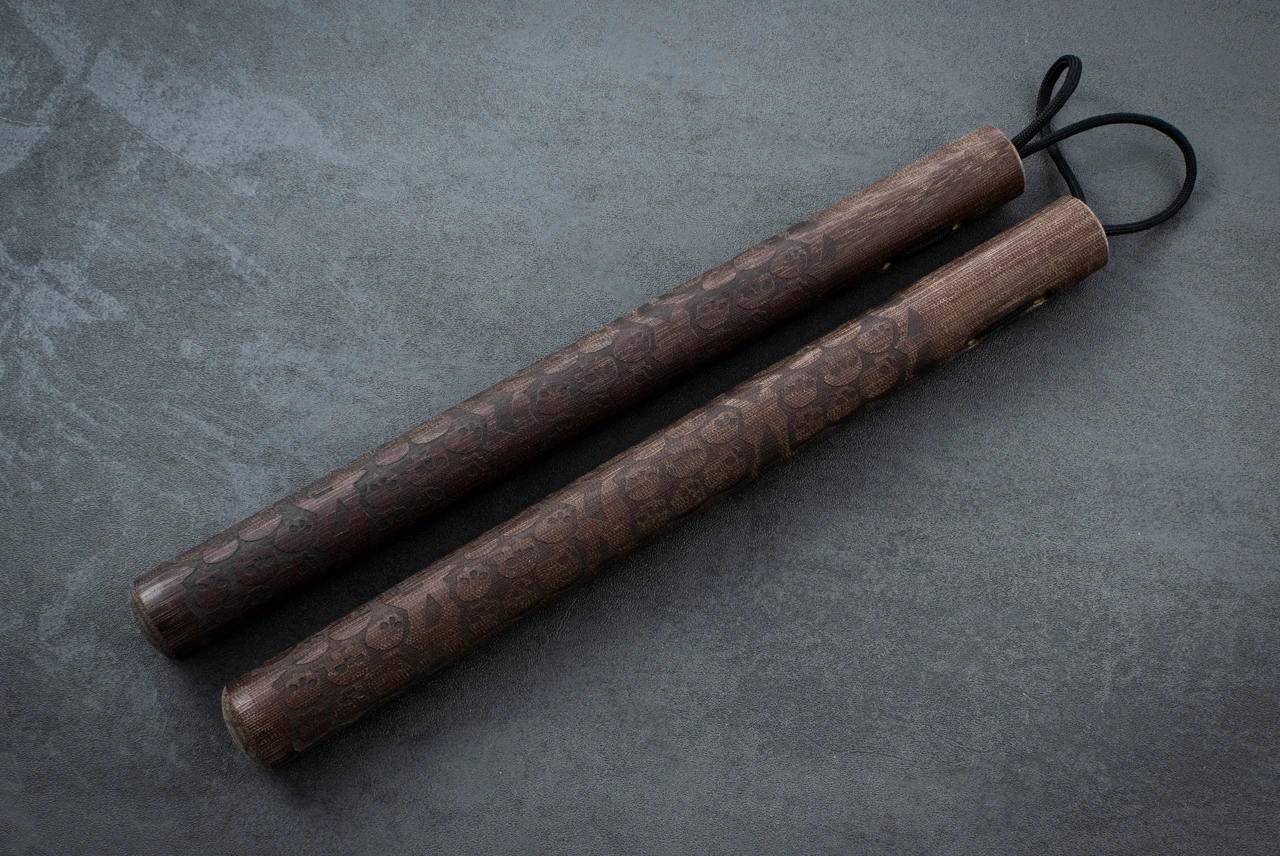 RMJ Tactical Gold Point Forge Nunchuck Brown Micarta Catacomb of Skulls Theme