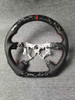 Close-up of the carbon fiber finish on the aftermarket steering wheel for Toyota and Lexus models