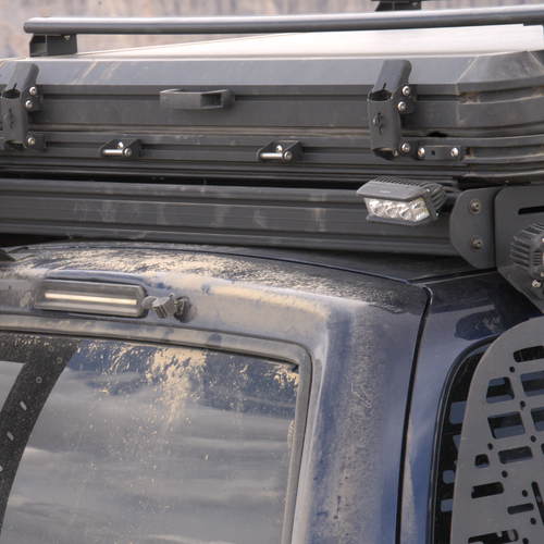 R5 Series 5-Inch LED Pod Lights mounted on a 4Runner roof rack, providing wide beam coverage on an overland expedition