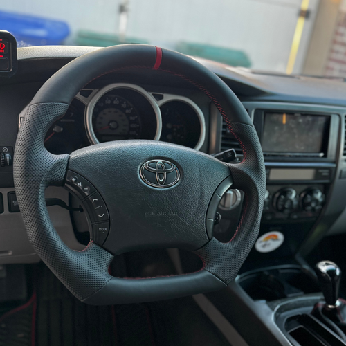 Aftermarket upgraded steering wheel for 4th Gen 4Runner, shown in standard finish with ergonomic design