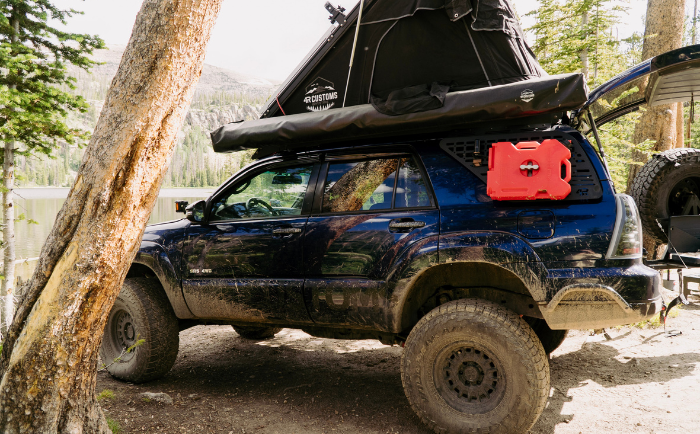 4th gen Toyota 4Runner by a lake showing a capable trail-ready build