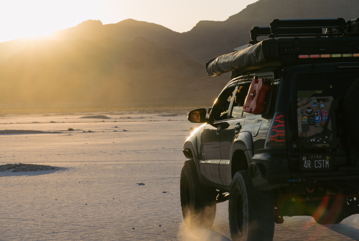 4th gen Toyota 4Runner driving into a sunset with a cinematic trail-ready look