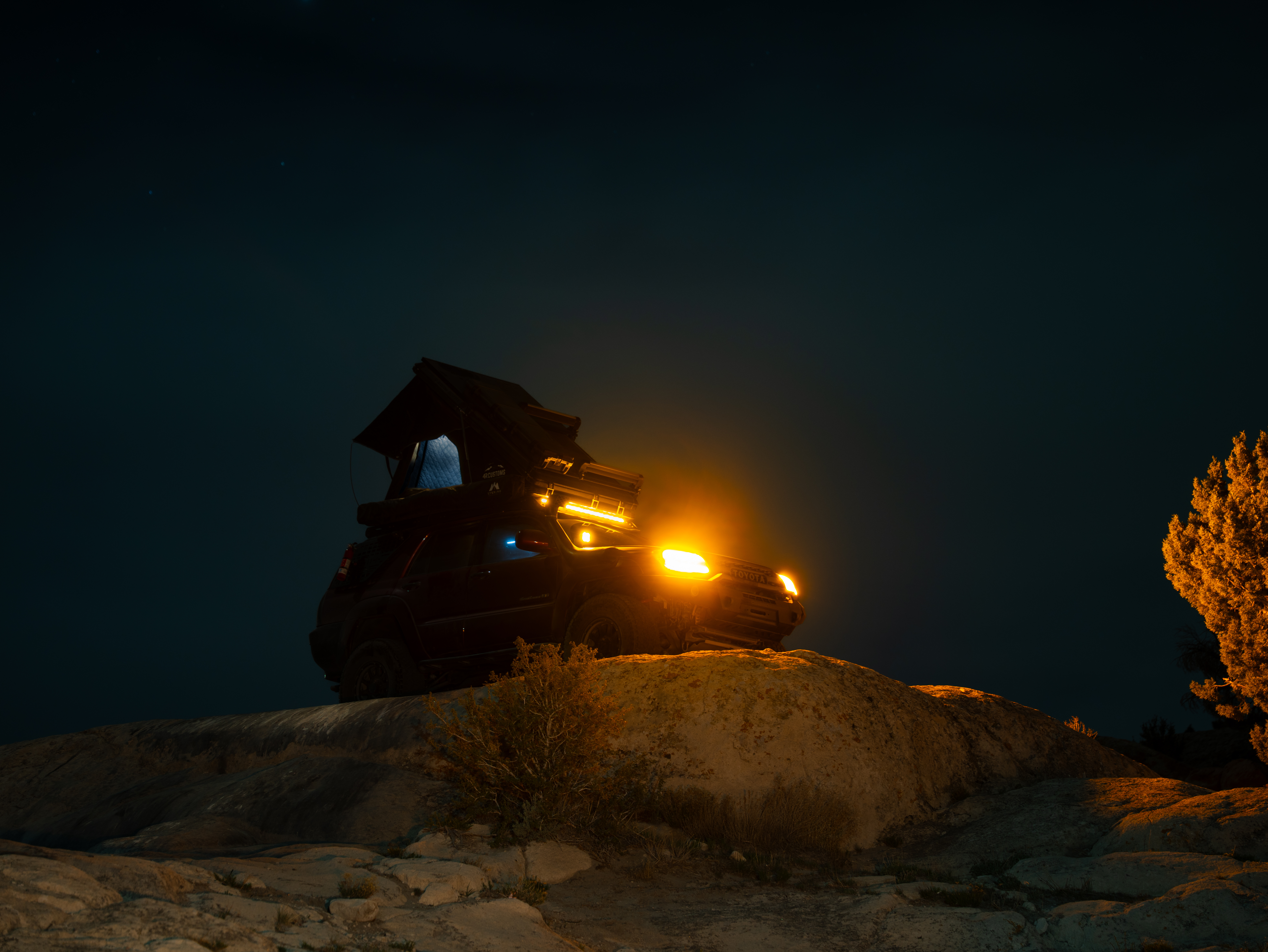 Toyota 4Runner parked outdoors in a scenic setting for a customer build feature