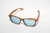 Zebrawood wayfarer sunglasses with ice-blue mirrored lenses on a white background