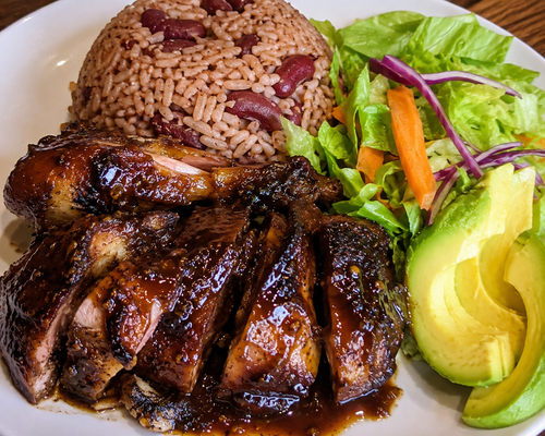 FoodUP™ Cultural Dining
Caribbean cuisine and storytelling through food.
Tropical Elixirs
Fresh island beverages including ginger, pineapple, herbal blends.
Sponsor This Experience
CARIBBEAN DINNER EXPERIENCE
Jerk Chicken, Rice & Peas + Island Sides
Pre-Order $30 | At Event $35 (Limited)