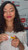Pineapple Pop™ pH-Vibes™ Mineral Gloss by Robyn Ryan™ in a sleek white tube with a clear applicator. This vibrant yellow mineral lip gloss transforms into a personalized pink or berry tint using pH-reactive technology while delivering high-shine hydration. Caribbean-inspired beauty for all skin tones, especially melanin-rich skin.