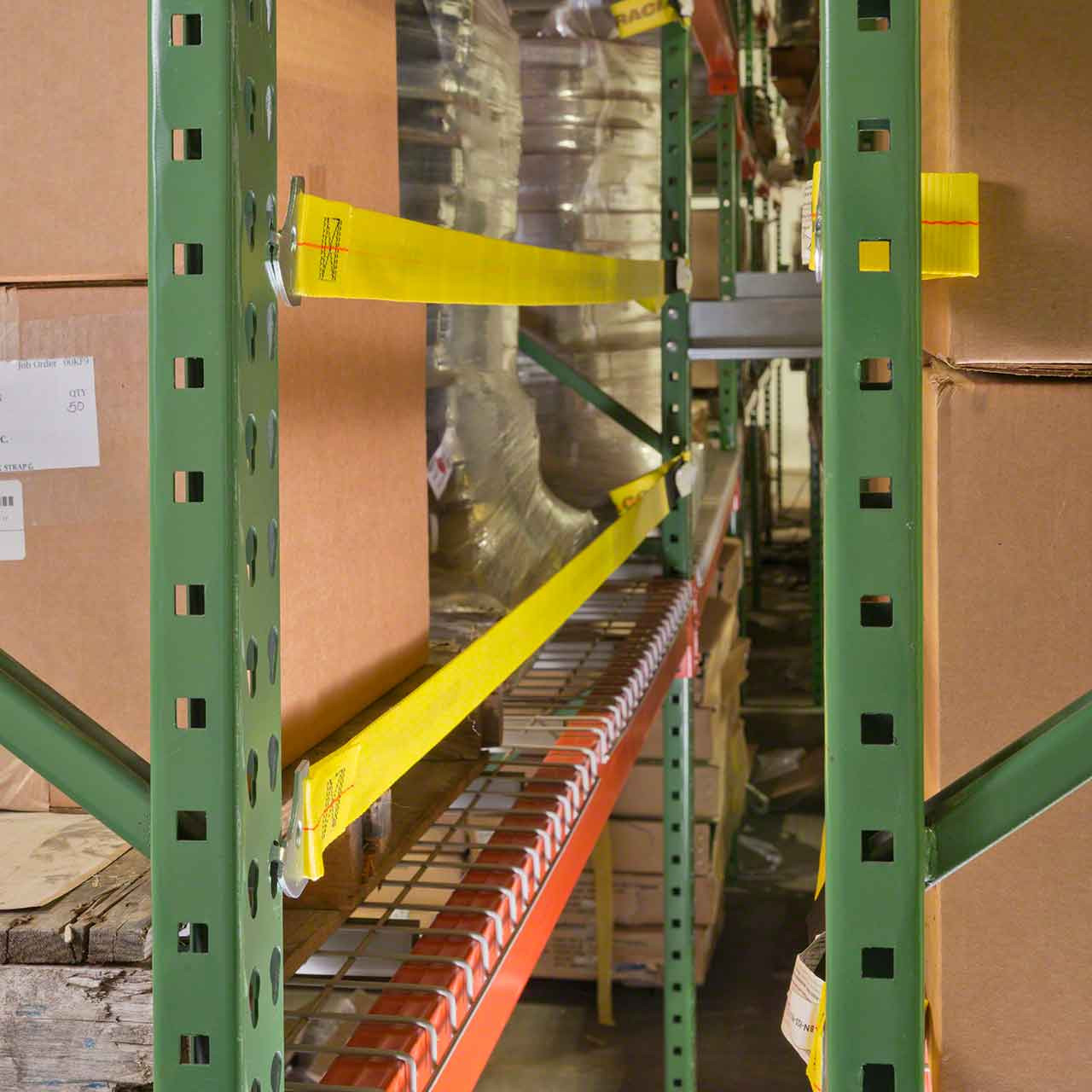 Safety straps get mounted to the back of the pallet racking