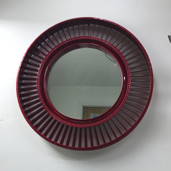 Crafted from a Pratt and Whitney JT8D engine fan blade, this wall hung mirror is a great addition to any space.  Available red, blue, green, orange, black, white and silver this piece blends aviation history with modern art and functionality.