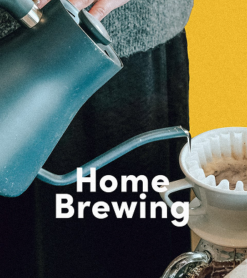 Hands holding hot water kettle pouring water over a coffee brewing device: Home Brewing Shopping Category
