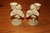 Pair Gold Tinged White Cherub Candlesticks