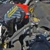 Proferred 1/4" Drive ratchet with extension bar and socket being used for automotive engine maintenance