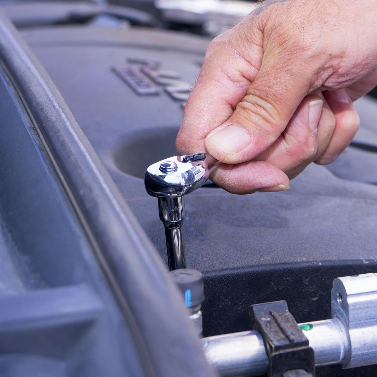 Proferred Pear Ratchet Handle being used with a socket in an automotive repair setting