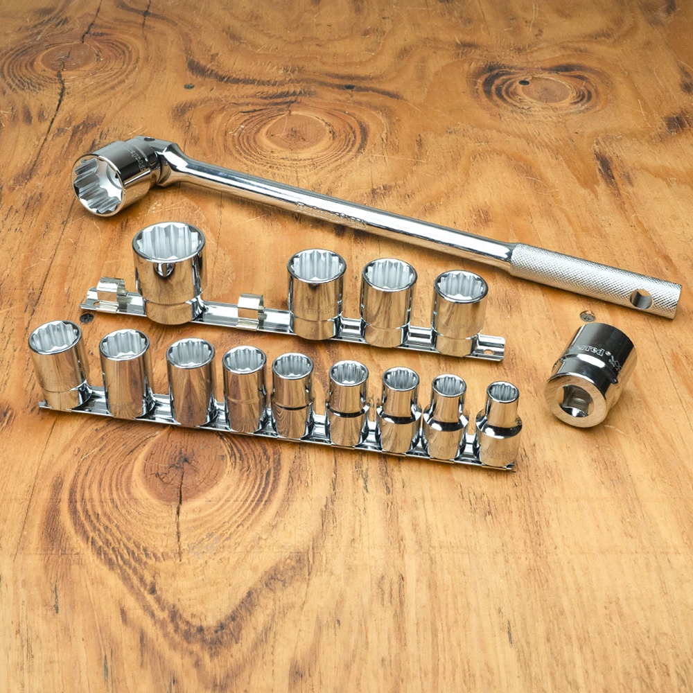 Proferred 1/2" Drive Metric 12-Point Standard Socket Set – 15 Piece with polished chrome sockets arranged on a wooden workbench