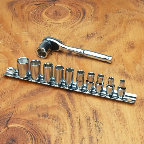 Proferred 1/4" Drive SAE 6-Point Standard Socket Set – 11 Piece with polished chrome sockets arranged on a wooden workbench