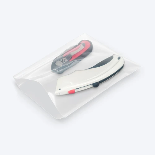 Clear open-end poly bag displaying assorted hand tools.