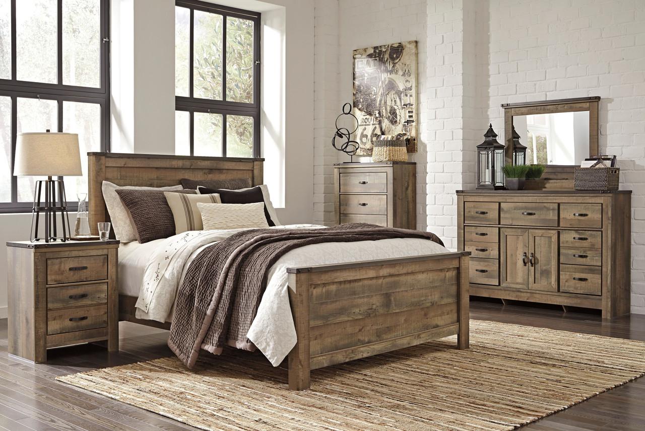 The Trinell Brown 7 Pc. Dresser With Fireplace Option, Mirror, Chest, King  Panel Bed, Nightstand available at Wier Furniture serving Lewistown, MT and  surrounding areas.