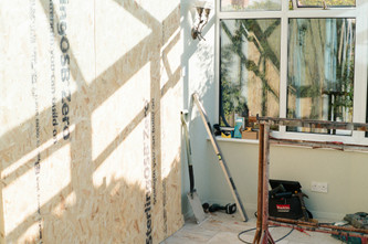 How to Remove Blown-In Insulation From Walls: Access Holes or Open Drywall