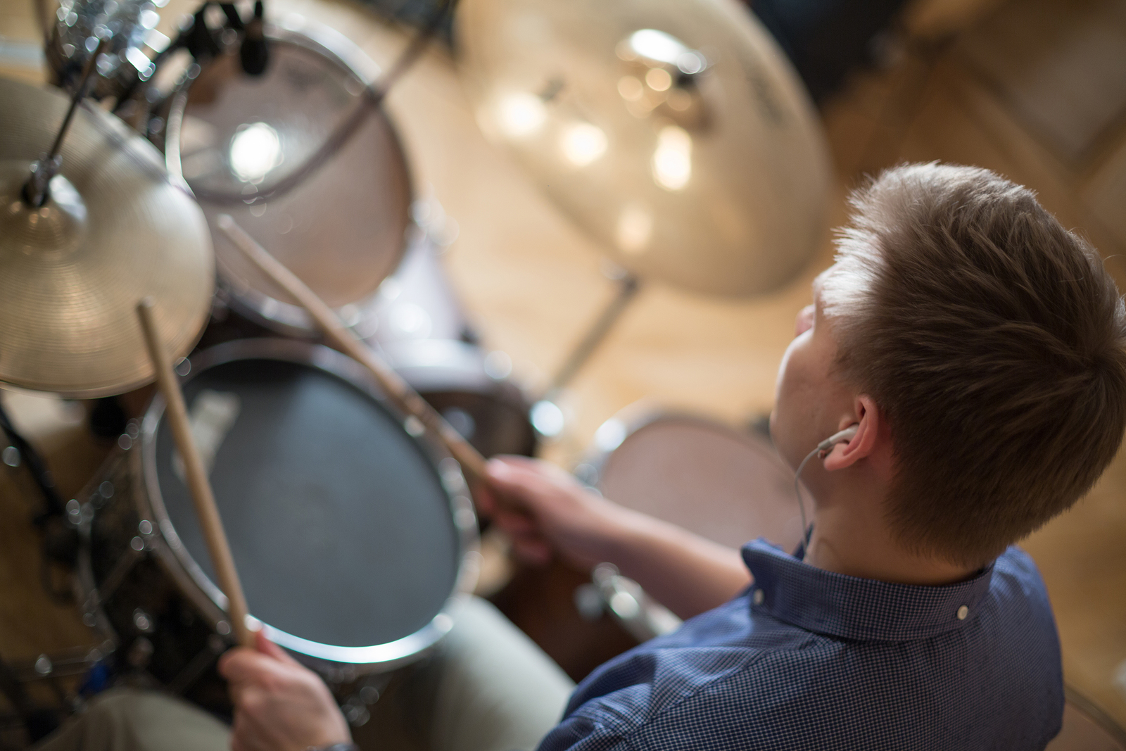 hearing aids and plaaying drums