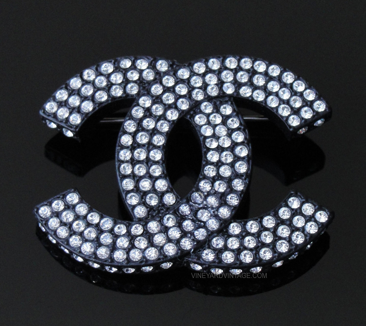 CHANEL BLACK METAL & CRYSTAL FILLED CC LOGO BROOCH