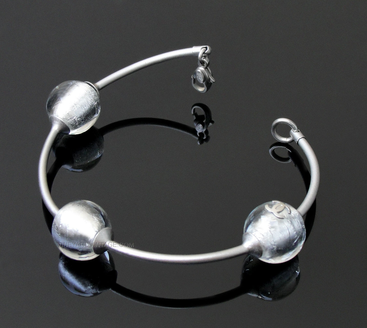 CHANEL VINTAGE GLASS ORB AND CC LOGO BANGLE BRACELET CHANEL VINTAGE GLASS ORB AND CC LOGO BANGLE BRACELET
