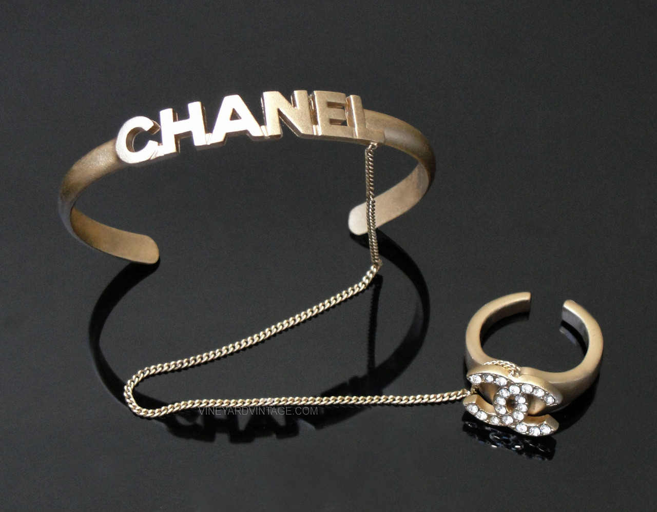 CHANEL RARE CRYSTAL CC RING & LETTER CUFF HAND CHAIN as seen on Miley Cyrus