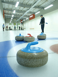 curling team playing on the ice