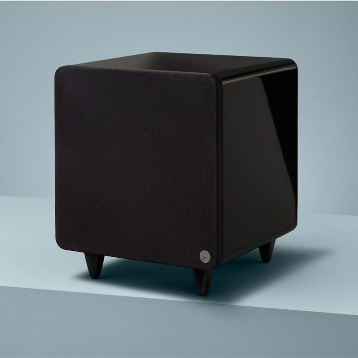 lifestyle view of minx subwoofer in a green background