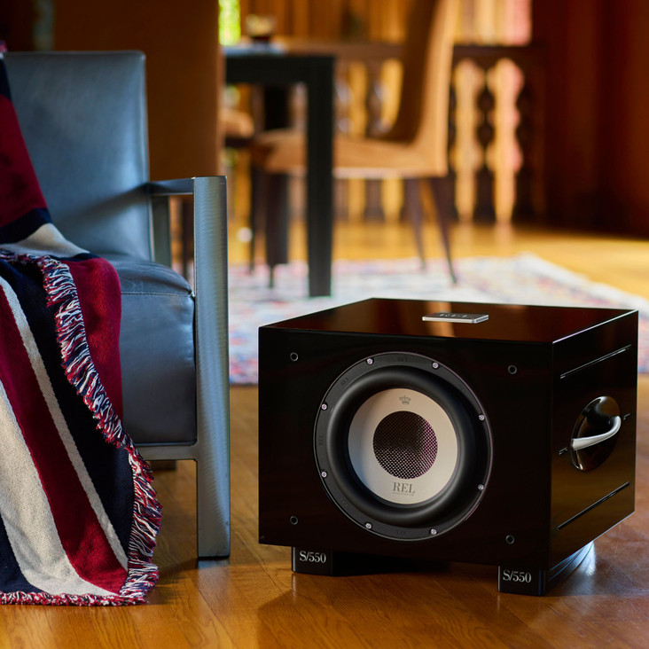REL S550 10" Powered Subwoofer, piano black finish in elegant living room