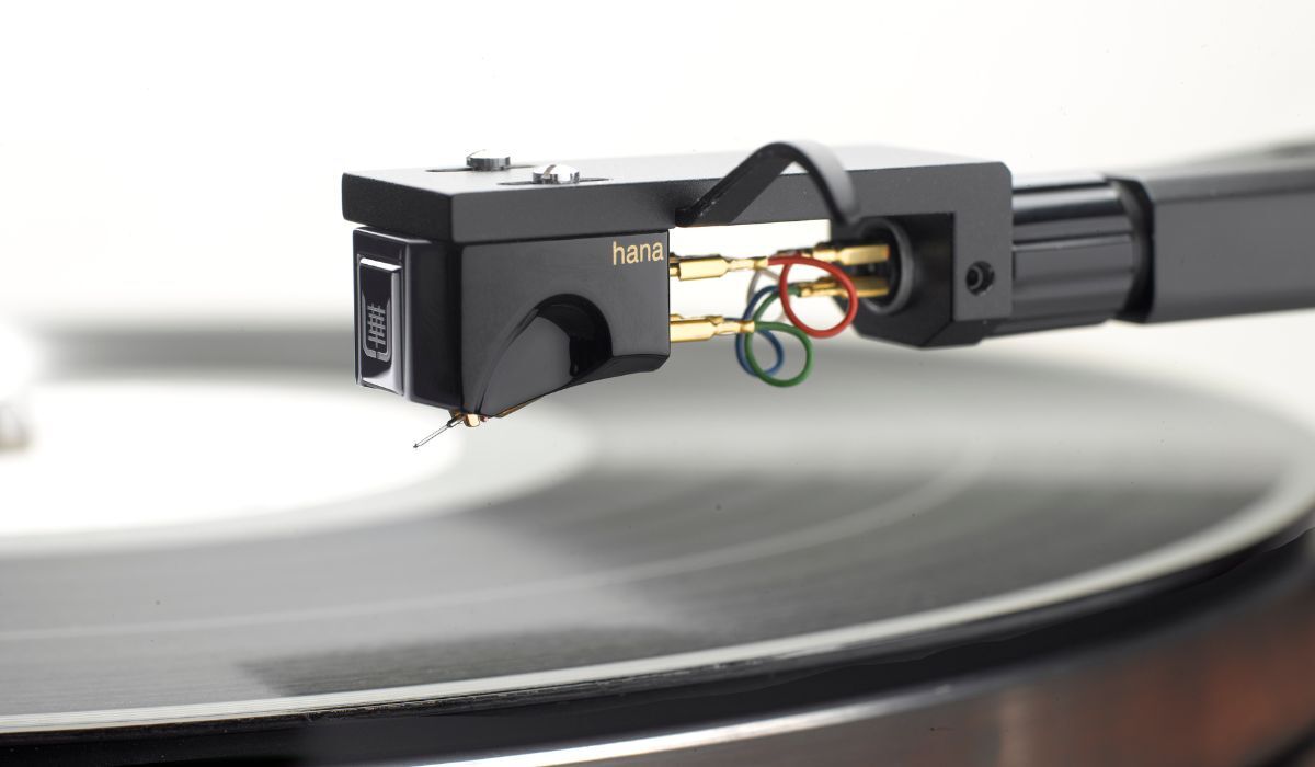 Hana Umami Black Low-Output Moving Coil Cartridge, mounted on tonearm above spinning record