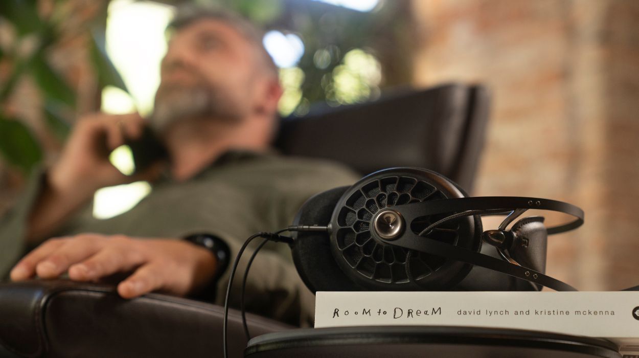 Meze 105 AER Open-Back Headphones, on book in living room
