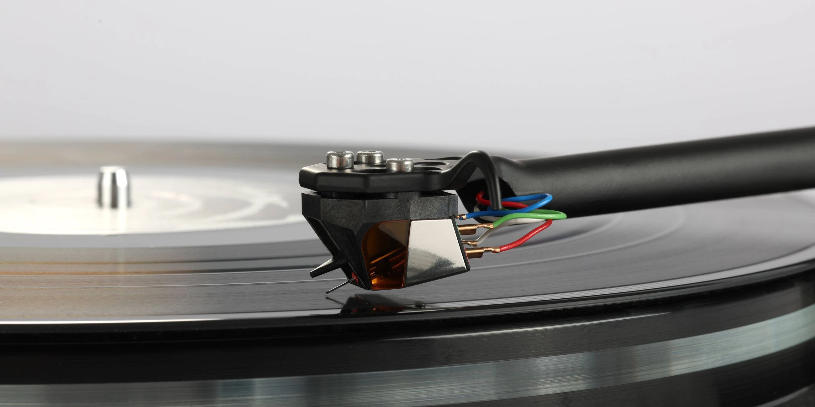 Rega Nd9 cartridge over record, mounted on tonearm