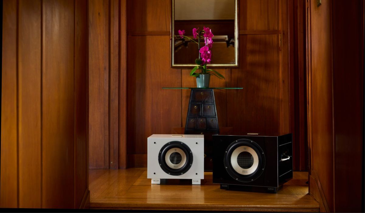 REL S850 10" Powered Subwoofer, black and white finishes in elegant living room