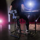 Gravity GFMSEAT1BR musician using seat on stage
