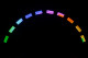 An arch of multi-colored stage lights.