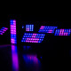 Stage panels glowing pink and blue.