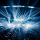 Crowd at a concert with bright lights.