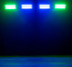 Blue and green stage lights in the dark.