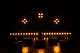 Dimly lit stage with amber lights.
