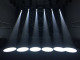 Six white spotlights shining on a stage