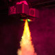 Fog machine shooting yellow-lit smoke.