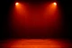Orange stage wash lighting on curtains.