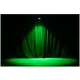 Green stage wash lighting on curtains.