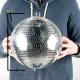 EM12 A person holding a 12-inch disco ball.