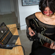 Woman playing guitar using iRig USB and tablet