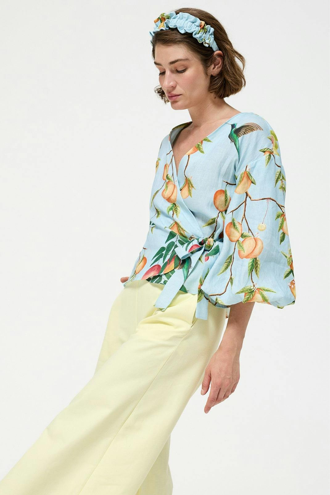 Wraparound linen blouse with V-neck and side tie