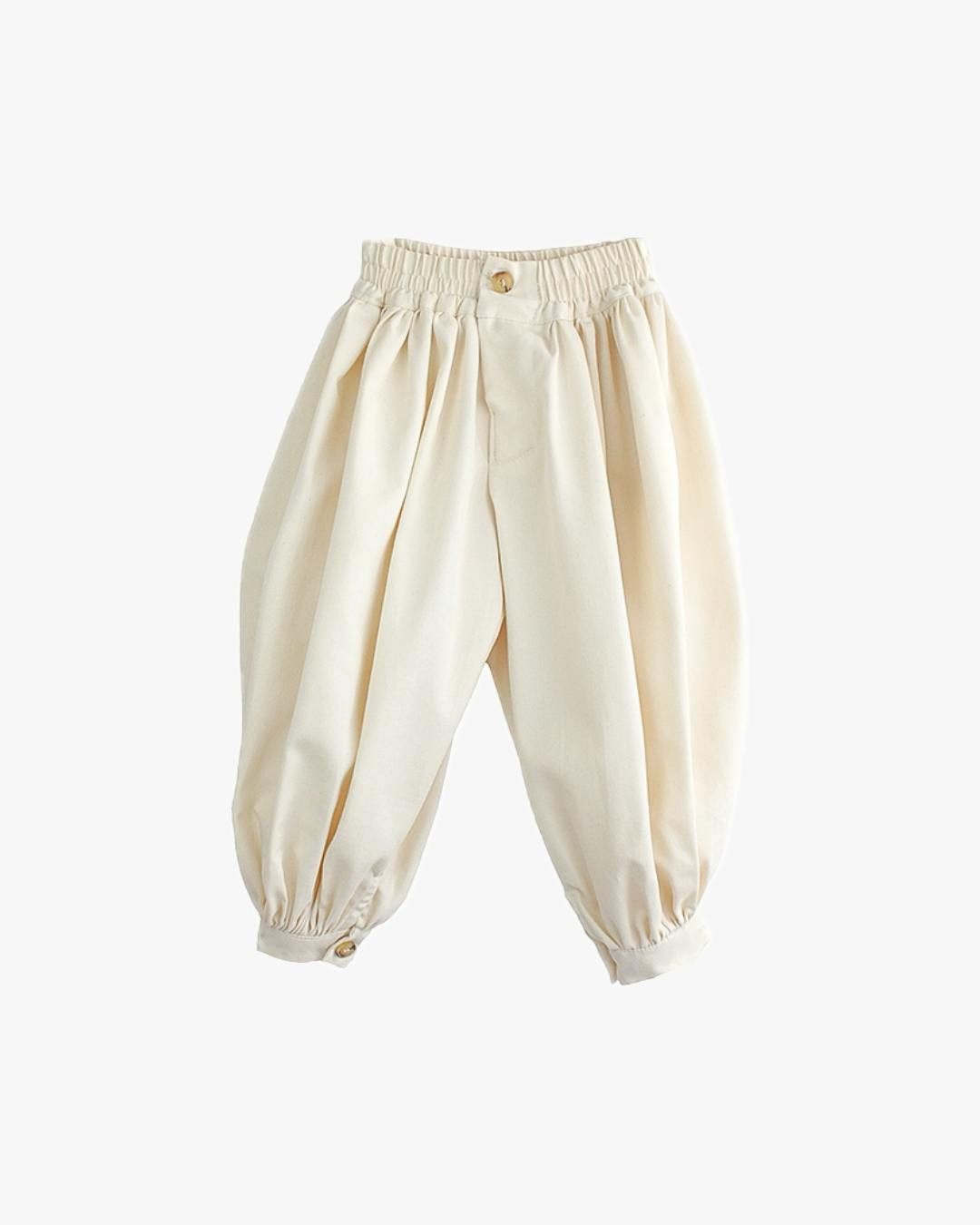 Pantalones de talle alto con pliegues y puños
