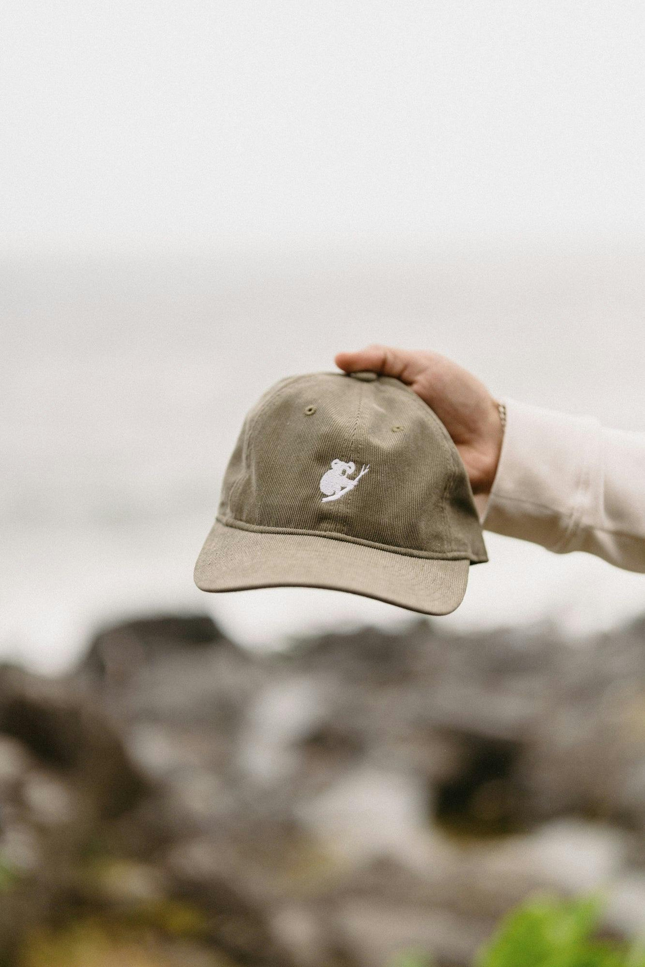 Corduroy cap with embroidered koala