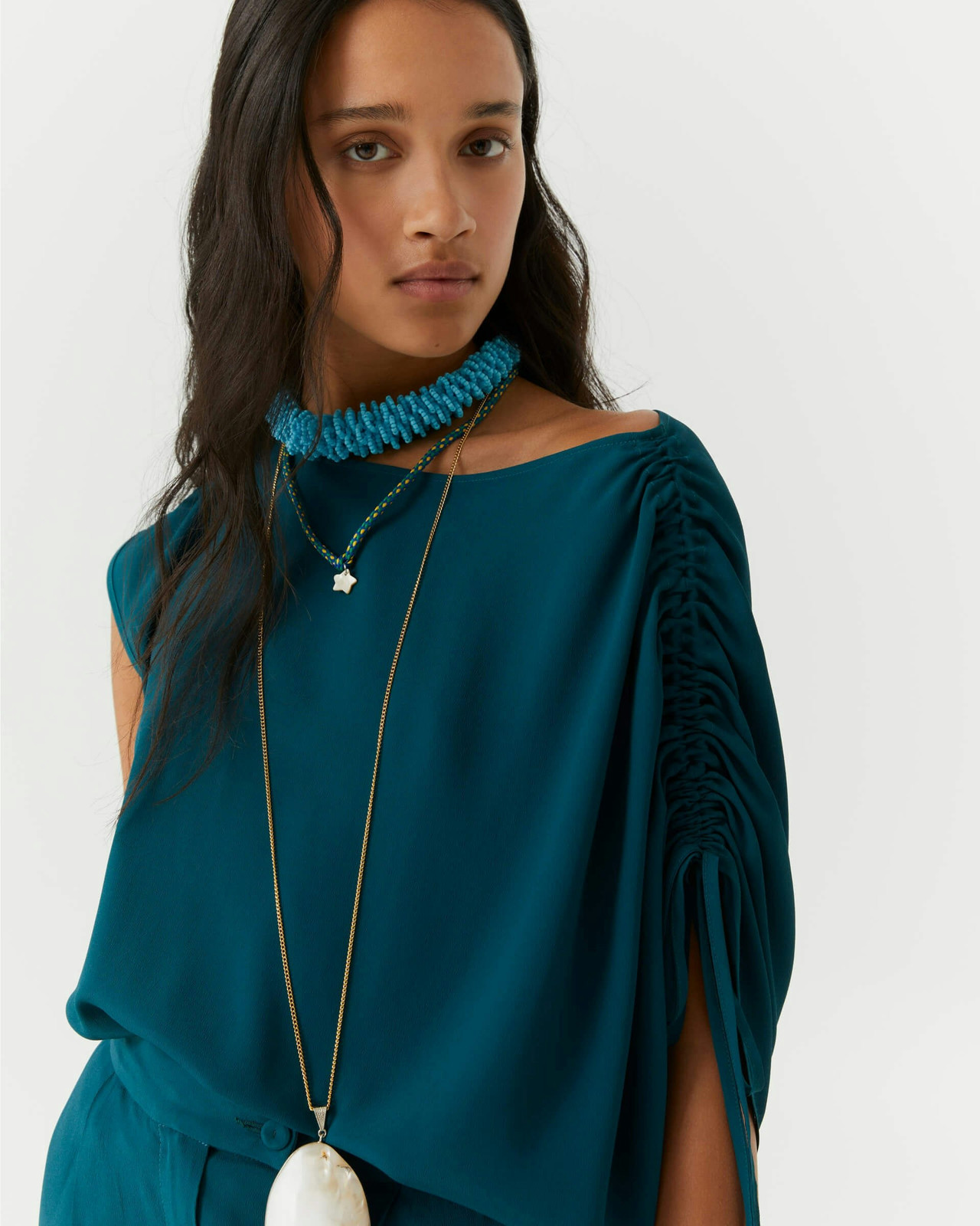 Top drapeado en jersey