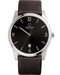 Relógio minimalista Obaku em aço inoxidável com mostrador escuro. Movimento de quartzo e fecho ajustável. Material: aço inoxidável. Estilo: minimalista.