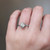S810-ZOE-WG-NVST1595 - Ring on Hand